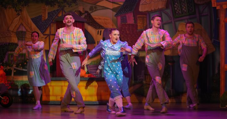 group of men and women singing and dancing as part of the annual Durham City Pantomime 